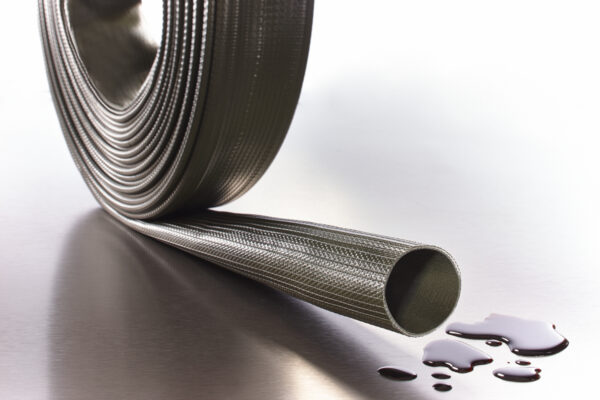 FLEXIBLE DE REFOULEMENT ENROULABLE A PLAT POUR HYDROCARBURES